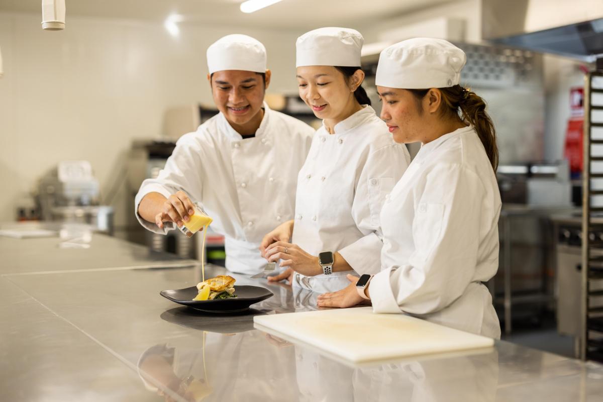 International students working in a kitchen