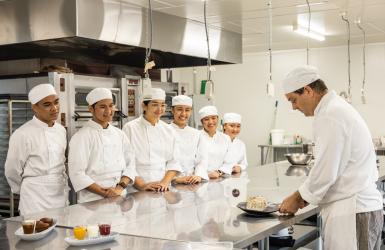 Cookery students working in the kitchen