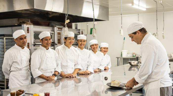 Cookery students working in the kitchen