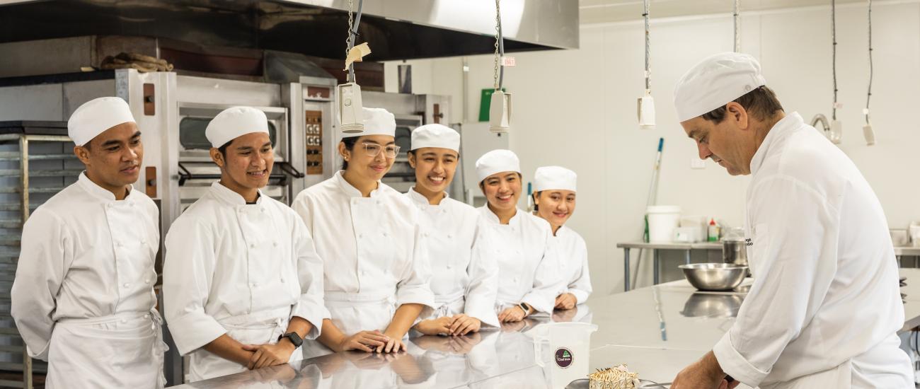 Cookery students working in the kitchen