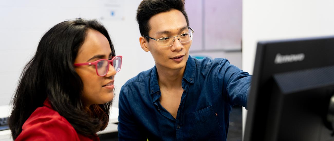 Students looking at computer